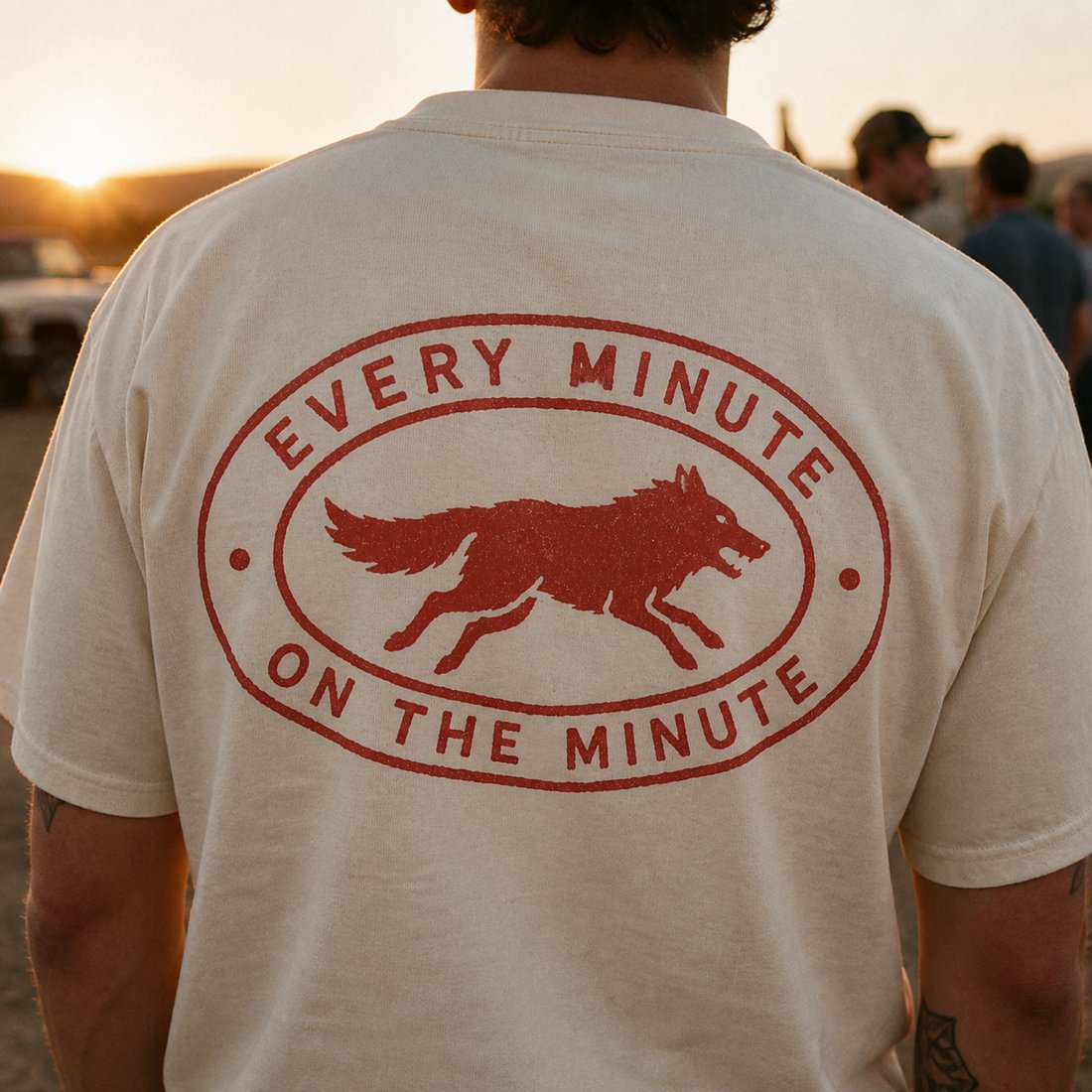 The oval logo printed across the back of a shirt at sunrise