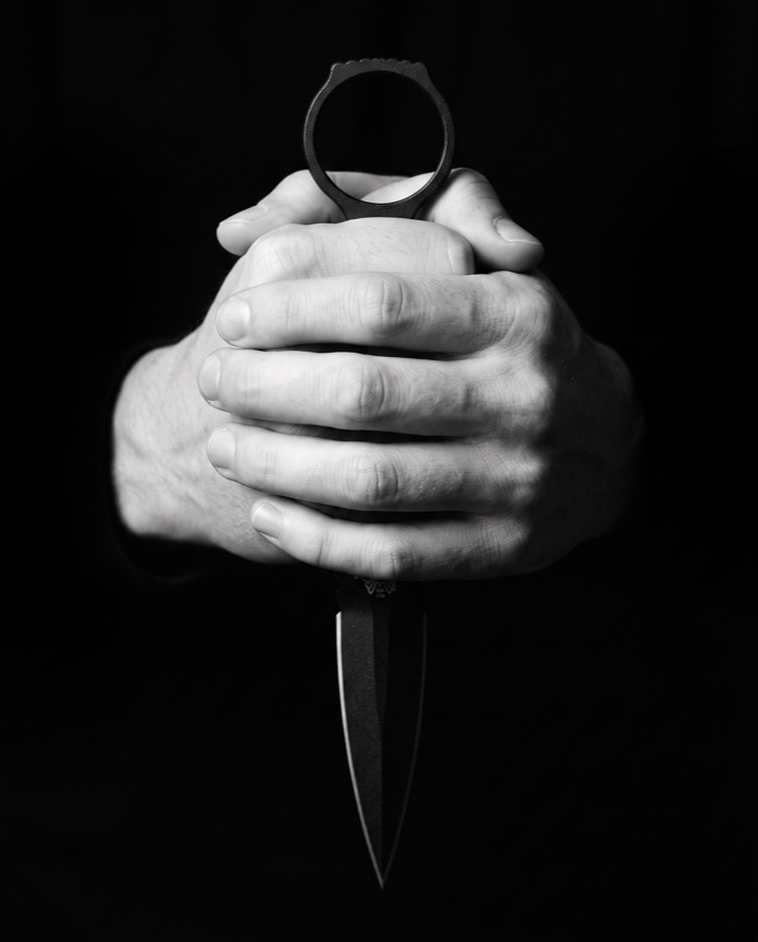A SOCP dagger gripped in a fist.